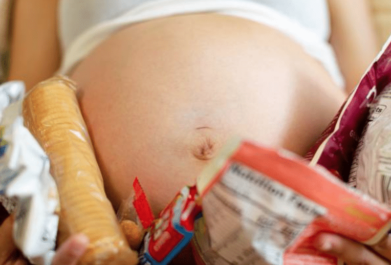 Pregnant person with food